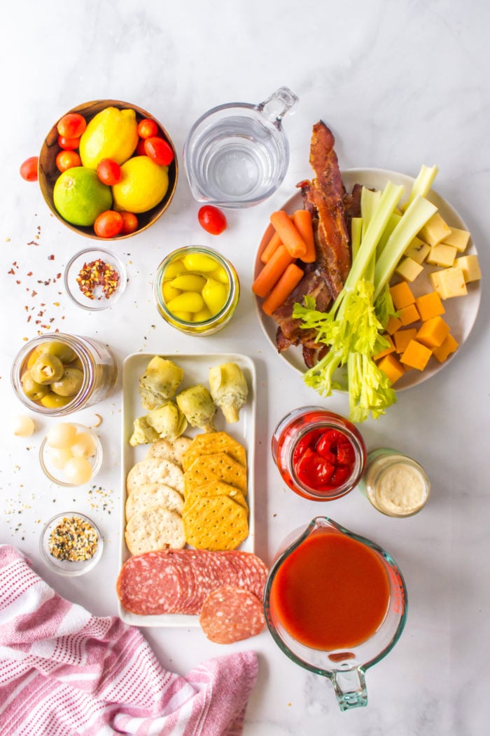 ingredients to make a bloody mary charcuterie board