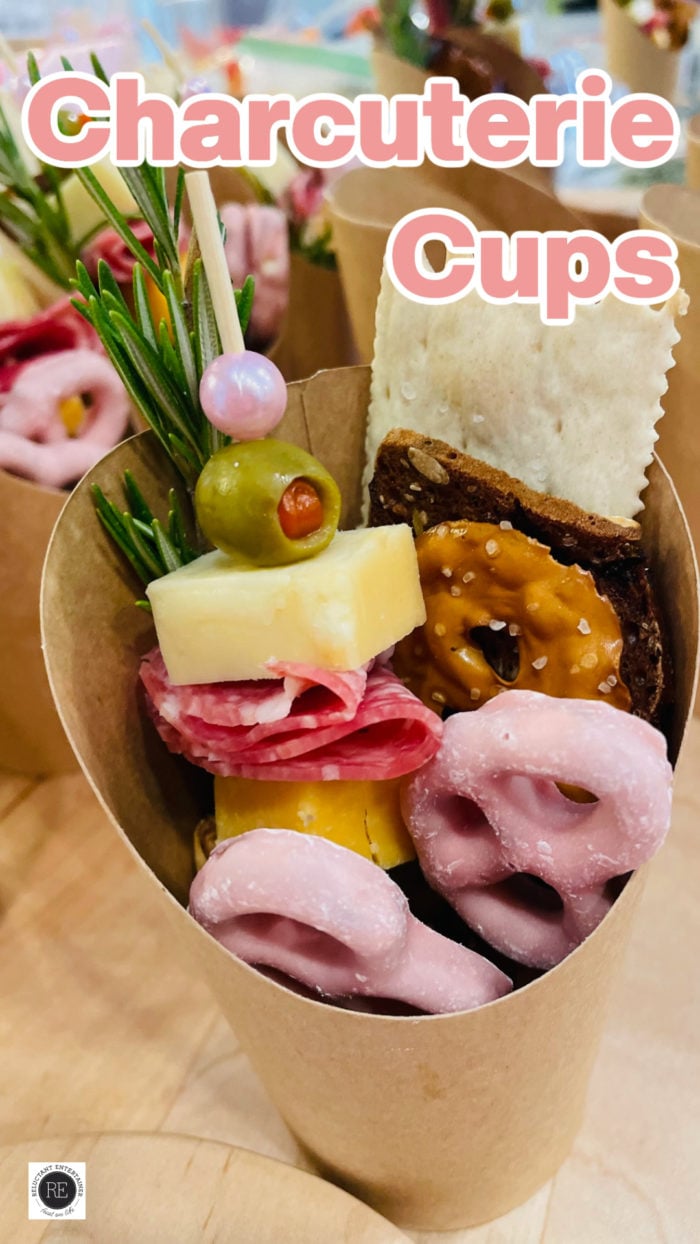 charcuterie skewer in cup with crackers