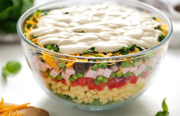 dressing on a layered salad