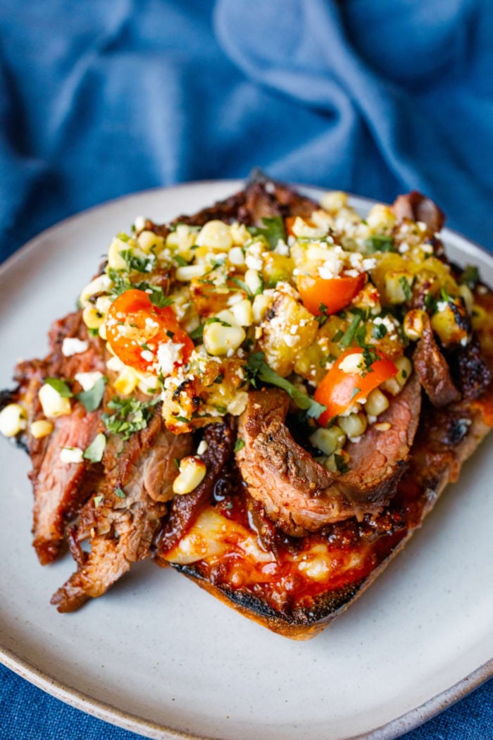 steak and corn on one piece of bread