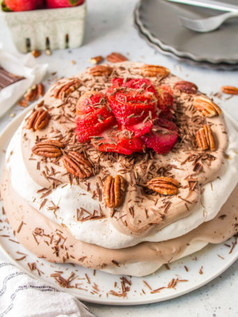 round meringue cake with chocolate and strawberries