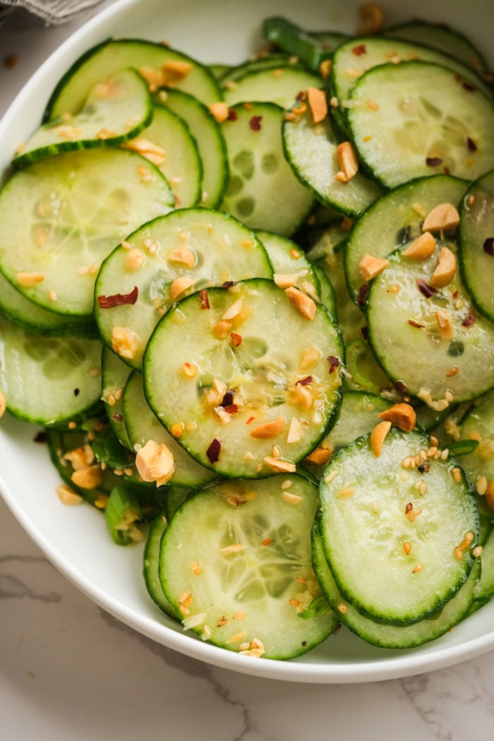 a tossed salad with cucumbers