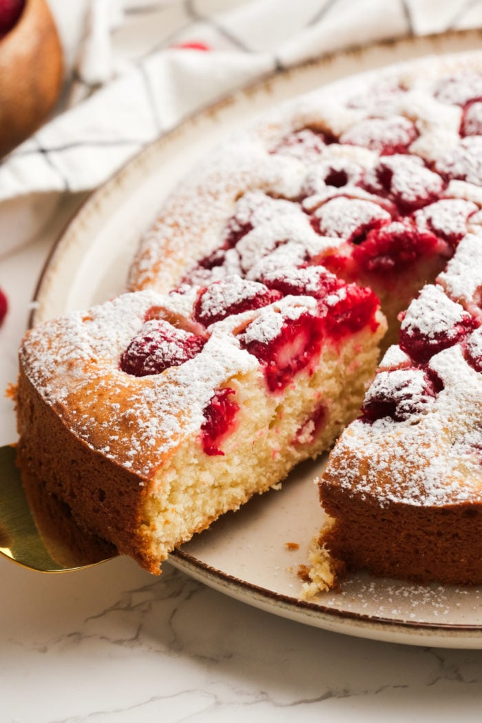 serving a piece of Summer Raspberry Cake