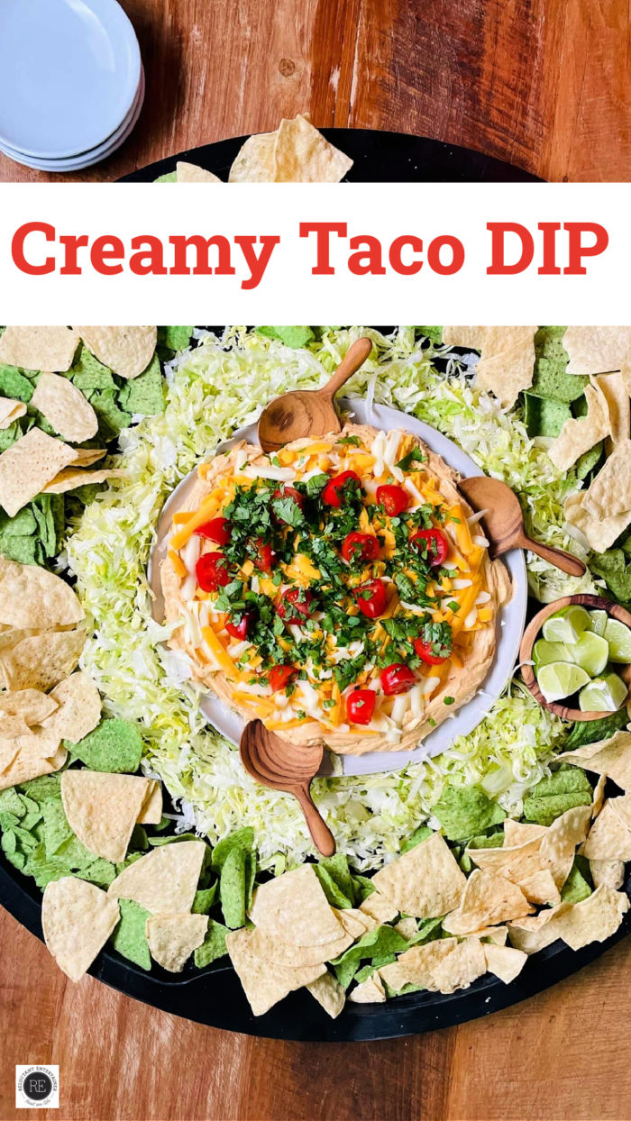 creamy taco dip served on a big board with chips