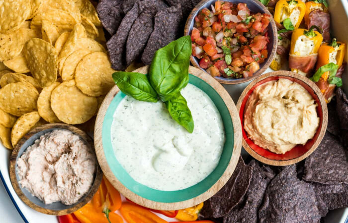 dips on a platter with chips