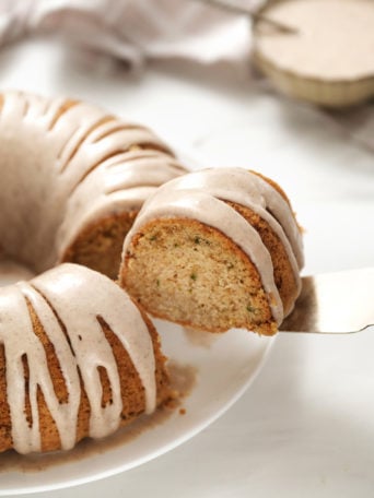 serving a piece of Zucchini Bundt Cake