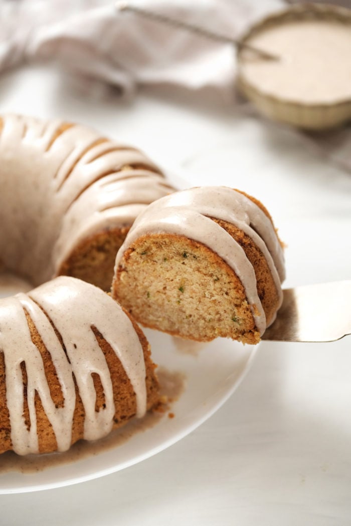 serving a piece of Zucchini Bundt Cake