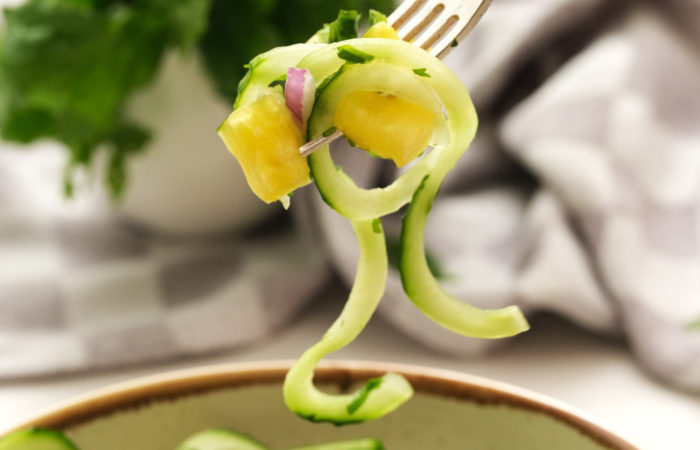 bite of cucumber onion pineapple salads