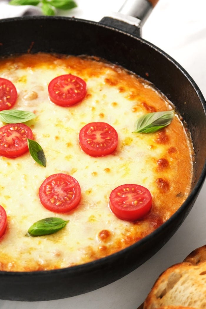 White Bean Tomato Bake in skillet with tomatoes