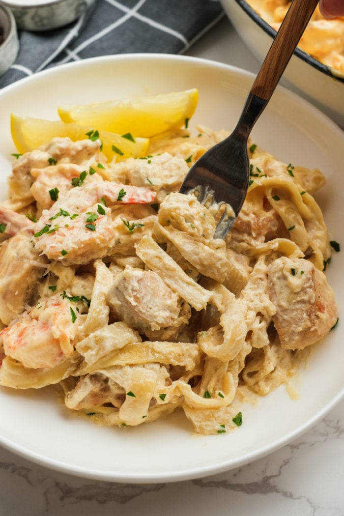 a bite of fettuccine pasta dish