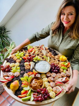 woman holding a Fall Dessert Charcuterie Board