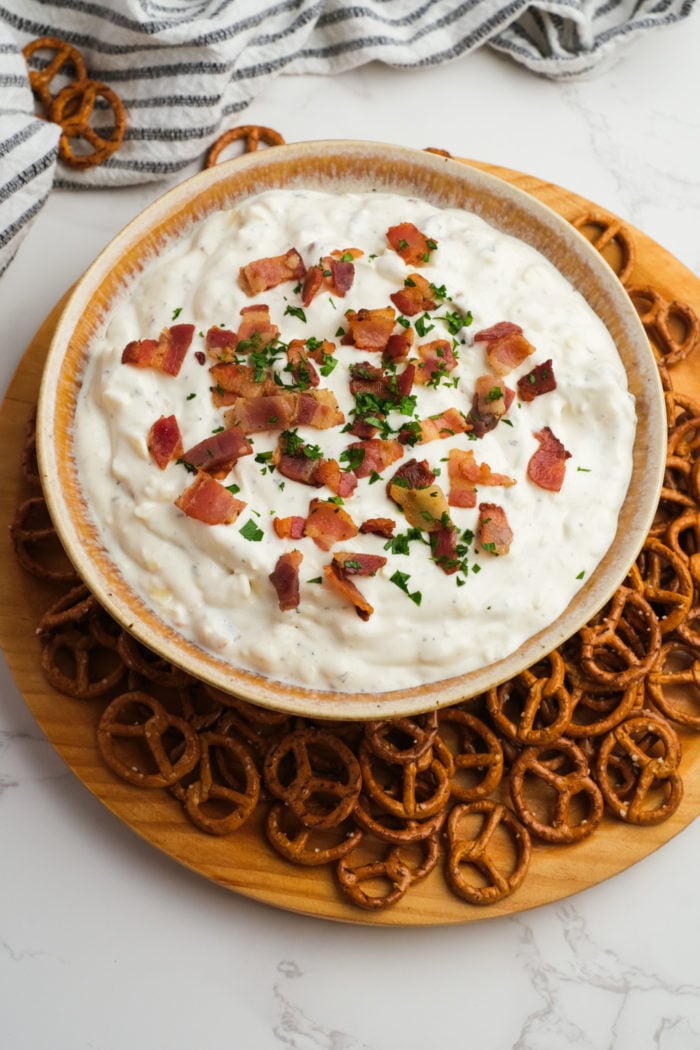 bowl of white dip with pretzels