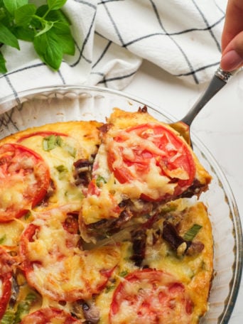 serving a piece of tomatoes in pie