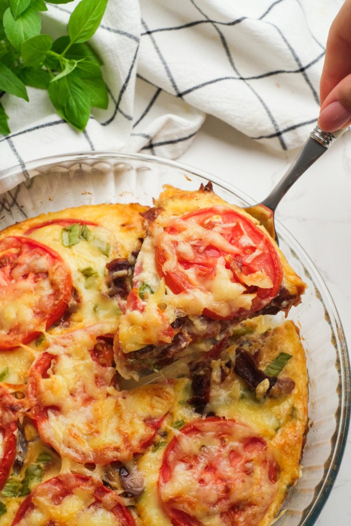 serving a piece of tomatoes in pie