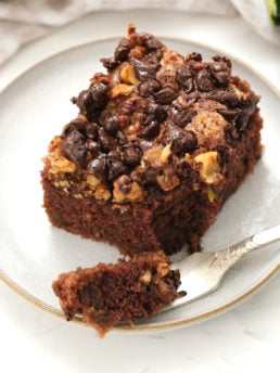 taking a bite of chocolate zucchini cake