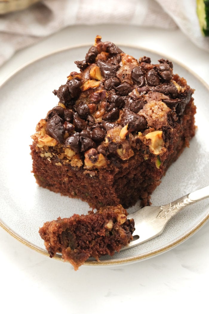 taking a bite of chocolate zucchini cake