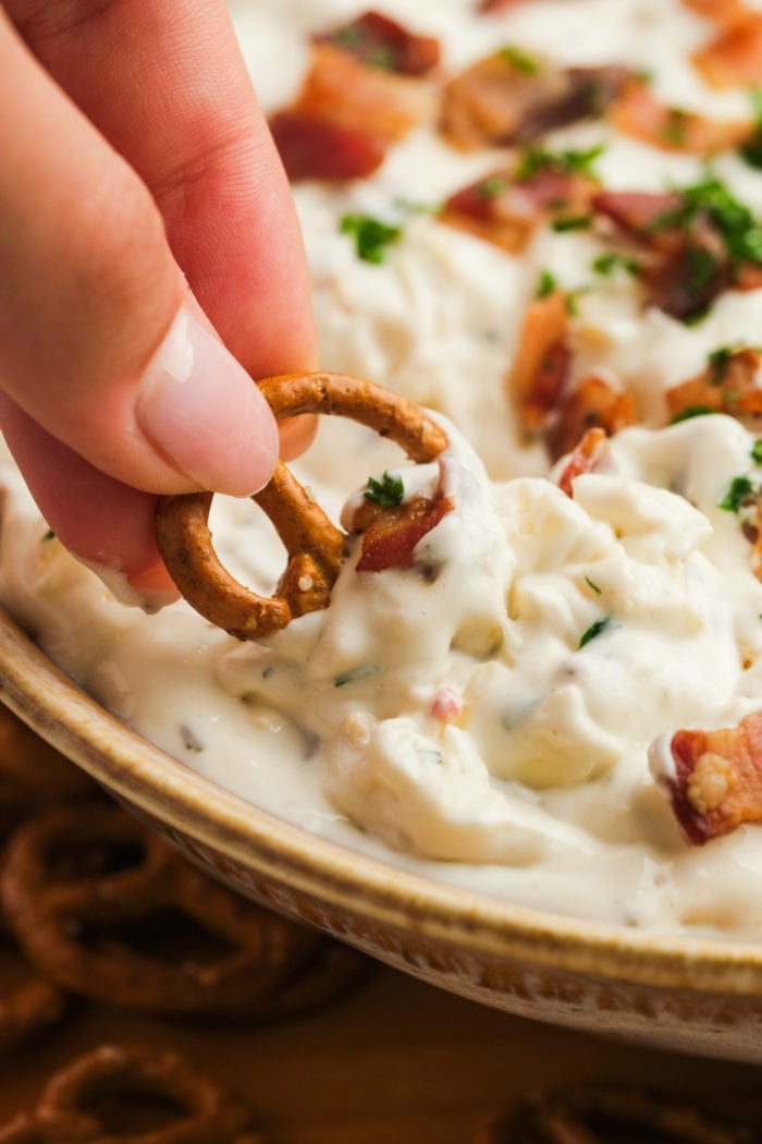 dipping a pretzel in ranch dips