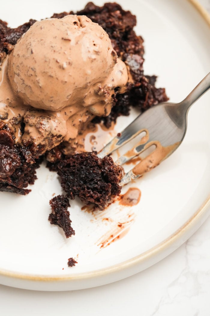 taking a bite of chocolate cake