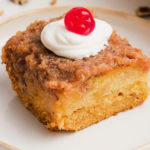 old fashioned cocktail cake with cream and a cherry