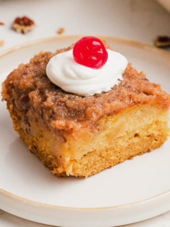 old fashioned cocktail cake with cream and a cherry