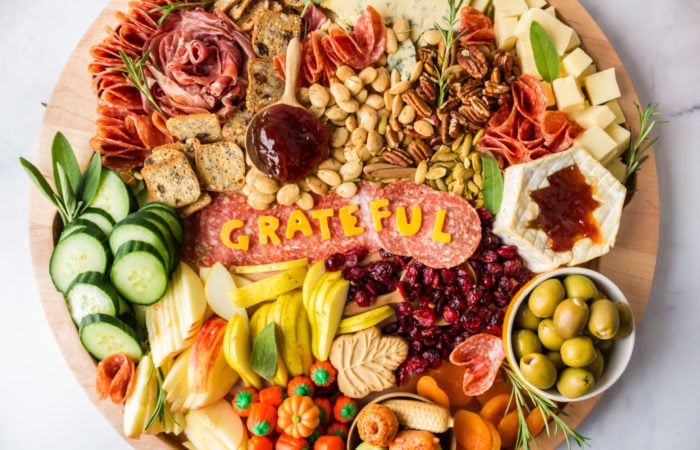 spelling out GRATEFUL with cheese slices