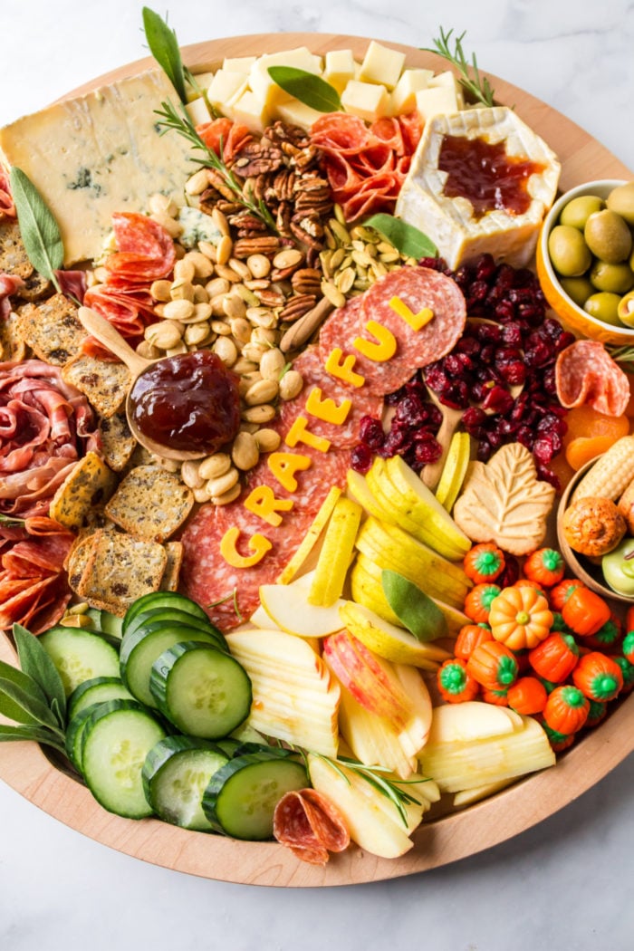 a charcuterie board that spells GRATEFUL