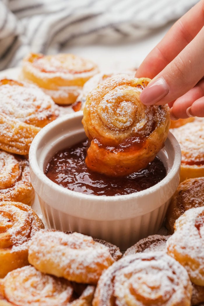 dipping a Monte Cristo Pinwheel in preserves