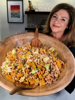 woman holding an epic bowl with taco pasta salad