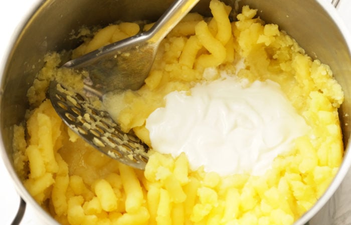 adding sour cream to potato recipe