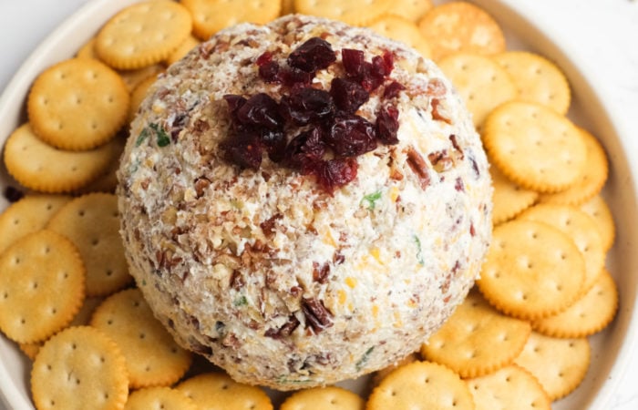 a round cheese ball with cranberries