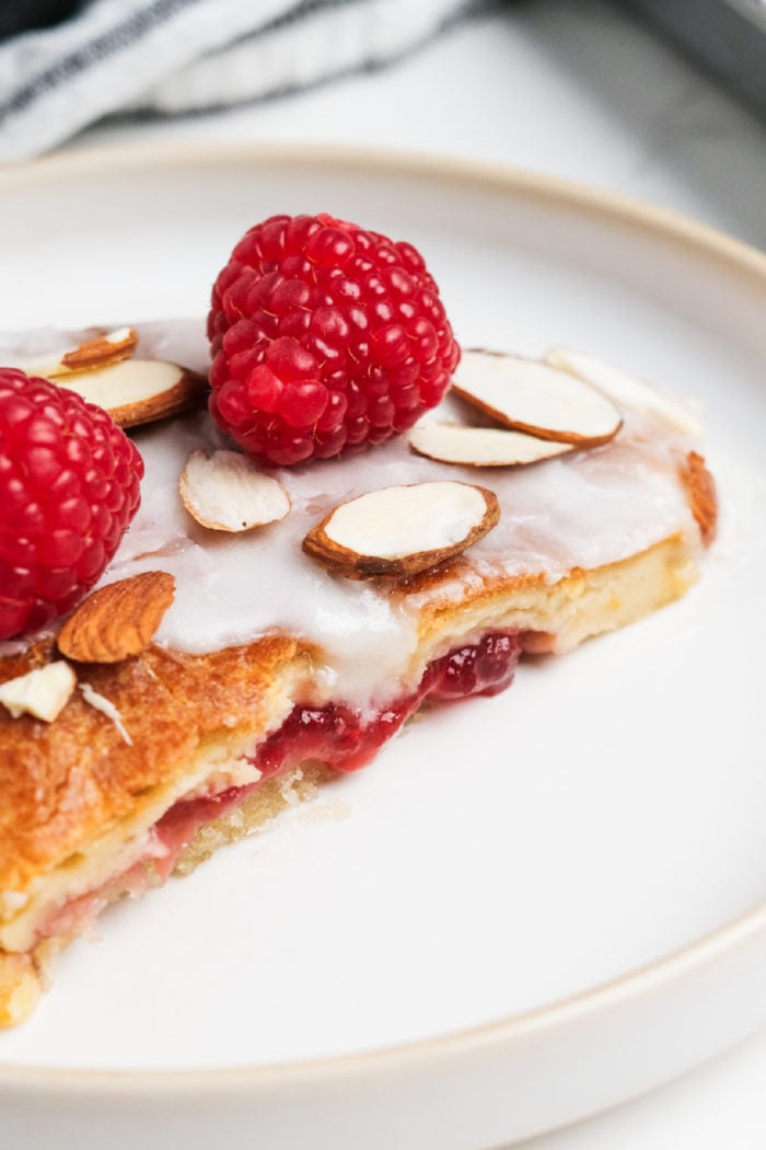 almond pastry with glaze and raspberries