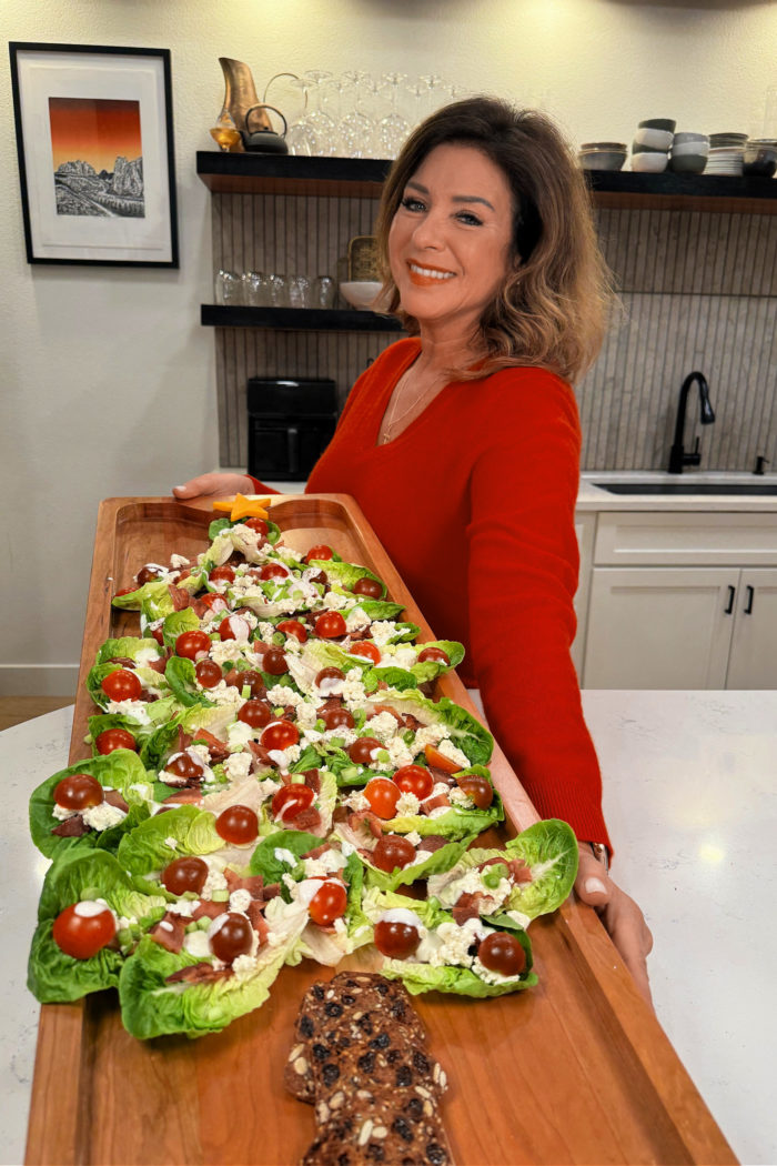 holding a big board with lettuce cups