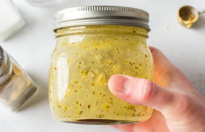 shaking a dressing in a jar