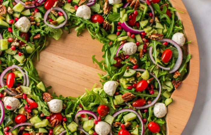 a salad shaped like a Christmas wreath