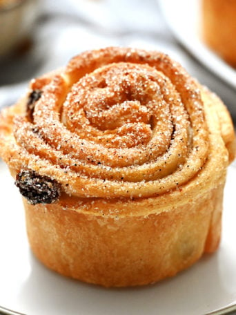 a cruffin with cinnamon and sugar and raisins