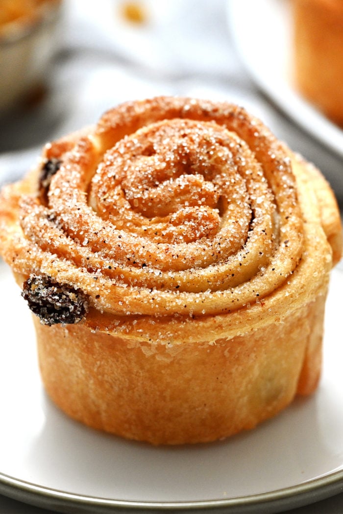 a cruffin with cinnamon and sugar and raisins