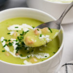 taking a bite of Leek and Potato Soup with Ham