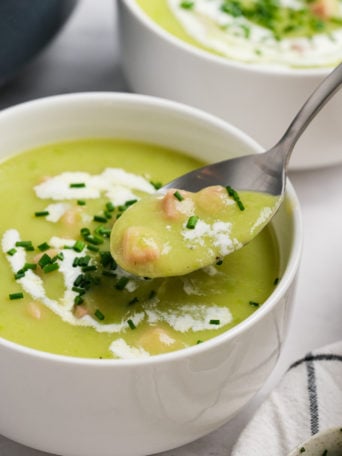 taking a bite of Leek and Potato Soup with Ham