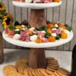 2 cake stands with Prosciutto Caprese Bites