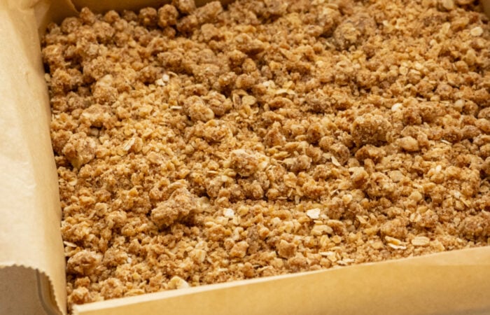 adding crumble topping