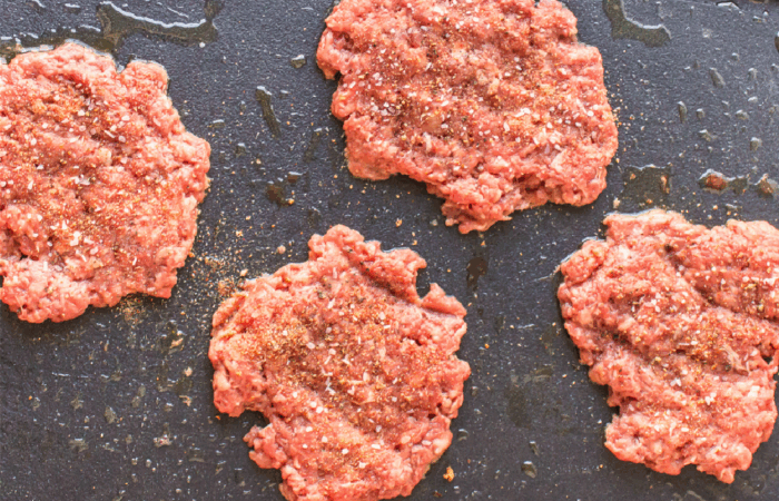 smashing burgers and grilling