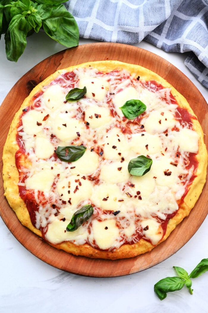 a round Margharita pizza made with cottage cheese crust