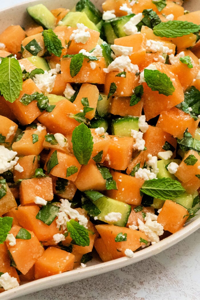 a Cucumber Melon Salad with Honey-Lime Dressing with mint
