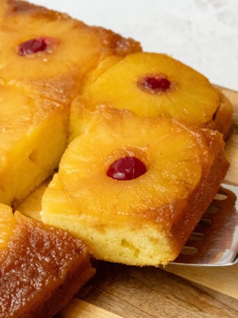 serving a piece of pineapple cake