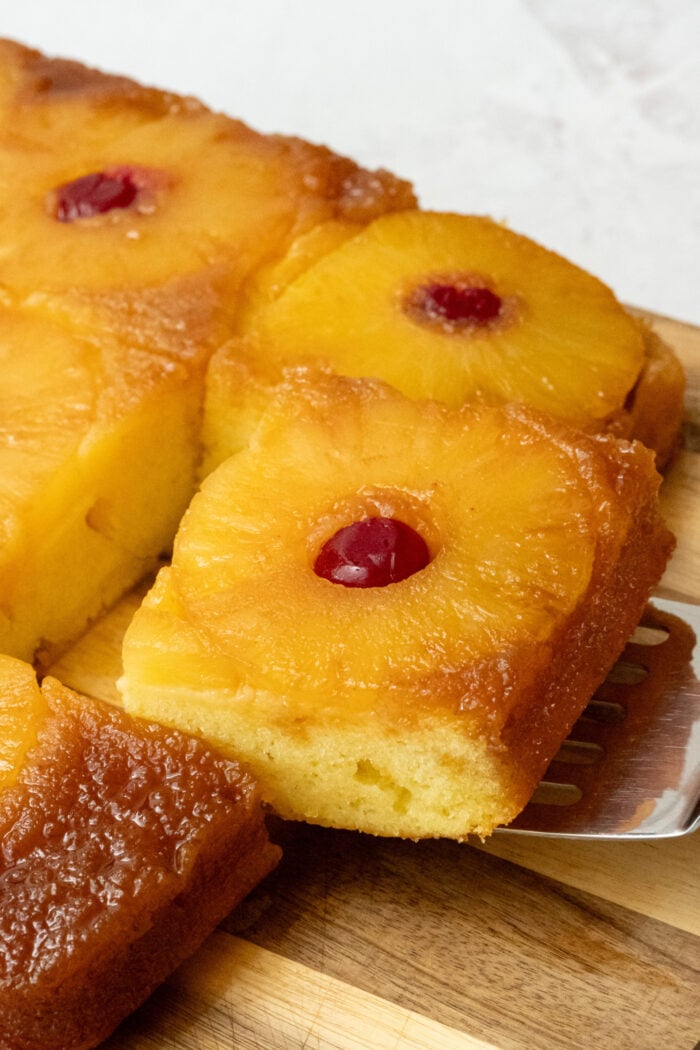 serving a piece of pineapple cake