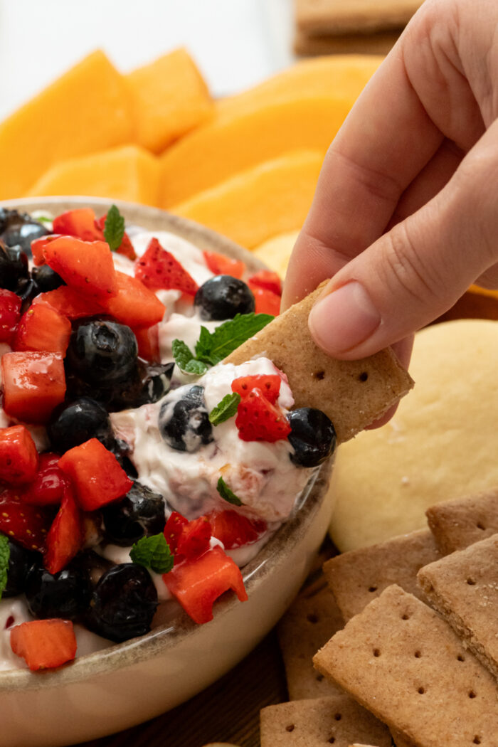 taking a bite of dip