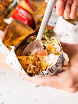 a fork bite of a taco salad in a bag