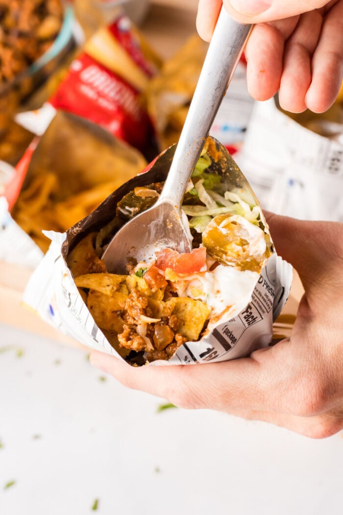 a fork bite of a taco salad in a bag
