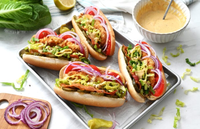 4 chicken sandwiches with sauce