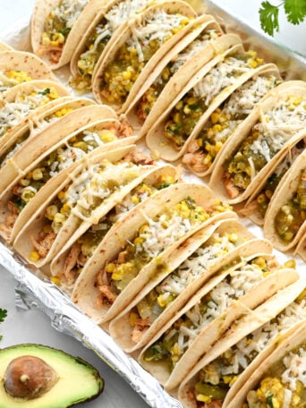 a sheet pan full of stuffed chicken tacos
